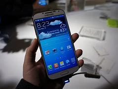 Image result for Hand Holding of Samsung Galaxy S4