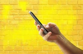 Image result for Boy Holding a Phone