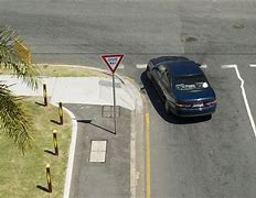 Image result for Lean Car Road Sign