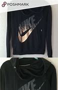 Image result for Black Nike Hoodie with Gold Angel Plyng Trumpet On Back