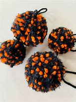 Image result for Orange and Black Pom Poms