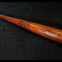 Image result for Picture of an Old Red Baseball Bat