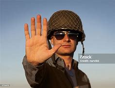 Image result for Picture of Soldier Holding Stop Sign