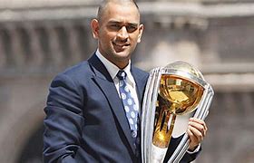 Image result for Dhoni with Trophy