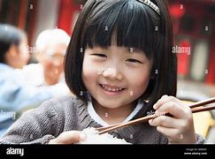 Image result for Girl Eating Rice