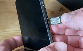 Image result for iPhone 11 Sim Tray Placement
