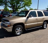 Image result for Gold Chevy SUV