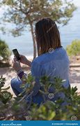 Image result for Back View of Woman Holding Phone