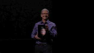 Image result for Tim Cook with iPhone 12