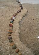 Image result for Pebbles in a Row Being Walked On