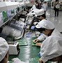 Image result for Apple Foxconn iPhone Assembly