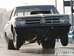 Image result for Black GTO at the Drag Strip