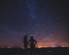 Image result for Man Looking Up in the Dark Sky