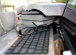 Image result for Laptop and Books