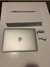 Image result for Apple MacBook Pro Laptop 100 Dollars with Gaqrage Band