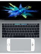 Image result for iPhone On Top Laptop