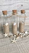 Image result for Glass Bottle with Cork in Sand