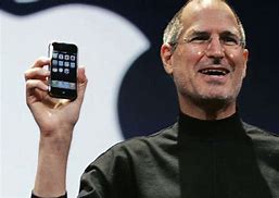 Image result for Steve Jobs Holding iPhone 1