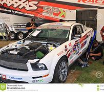Image result for mechanics working on mustang GTs