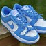 Image result for Black and Blue Dunks Low