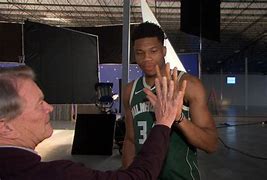 Image result for Giannis in a Stand Next to Fan