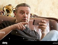 Image result for A Happy Surprised Man Using iPhone Alamy