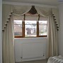 Image result for How to Put Up Curtain Tie Back Hooks