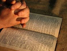 Image result for A Picture of Prayeing with Hand and Bible Book