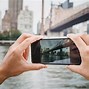 Image result for Taking Oicture with Phone