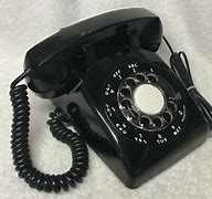 Image result for ITT Black Rotary Dial Telephone