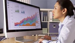 Image result for Desk with Data Analysis On Screen
