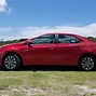 Image result for Red Toyota Corolla Cockroach