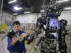 Image result for Person Working On Robot