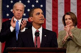 Image result for Joe Biden Giving Speech with Nancy Pelosi Smile Behind Him