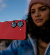 Image result for P Holding Phone with Camera