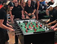 Image result for Foosball Table Played