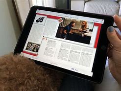 Image result for Girl Reading Magazine On iPhone 14 Pro Max