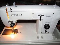 Image result for Nelco Sewing Machine with Flip Down Case