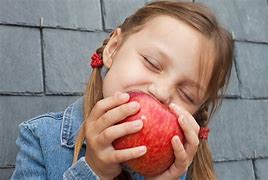 Image result for A Child Eating an Apple