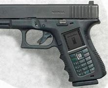 Image result for Pistol On a Table Phone Photo