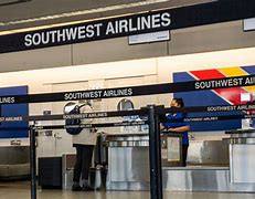 Image result for Southwest will limit hiring, drop 4 airports