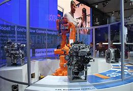 Image result for Robot Arms at Auto Factory