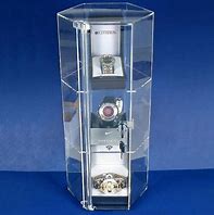 Image result for Lighted Locking Electric Rotating Jewelry Display Cases