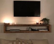 Image result for Wall Mounted TV with Shelf Underneath