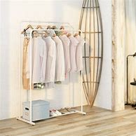 Image result for Clothes On a Hanging Rod
