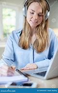 Image result for Image of Woman Studying with Headphones On