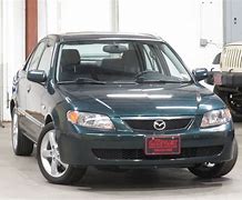 Image result for Green 2003 Mazda Protege