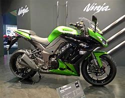 Image result for Kawasaki Purple White and Green