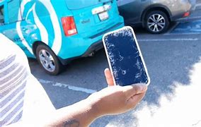Image result for Holding Smashed iPhone in Forest