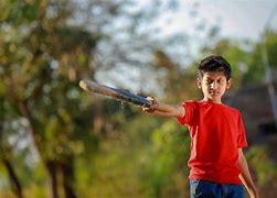 Image result for Kid in Under Tens Playing Cricket